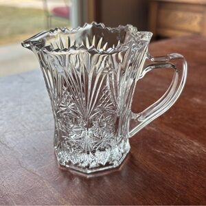 Studio Nova pressed glass creamer in the "Country Flair" pattern.